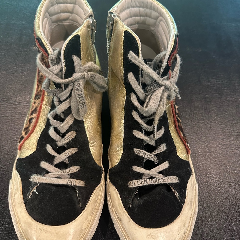 Golden Goose Black and Gold High-Tops with Red Accents